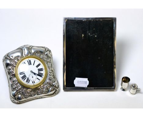 A Victorian silver mounted dressing table clock, silver frame, miniature silver tankard and goblet (4)