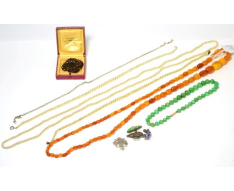 A jade necklace, an amber necklace and costume jewellery 