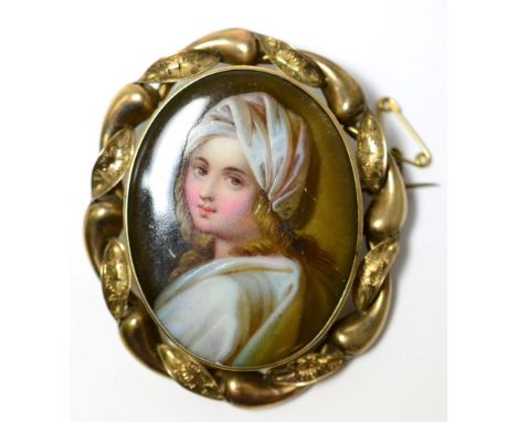 A Victorian portrait miniature on porcelain in a yellow metal mount 