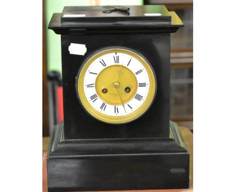 A Victorian black slate striking mantle clock, retailed by Edward & Sons, Paris, striking on a gong 