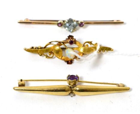 A 15ct gold opal and garnet bar brooch, a 9ct gold amethyst and diamond bar brooch and an aquamarine and garnet bar brooch (3