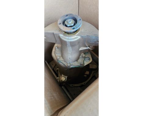 A, believed, NOS Austin gearbox, in crate together with a set of 4 Austin FG500 hubcaps