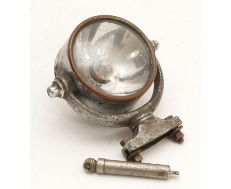 A vintage Stewart Warner body mounted 3 1/2" spot lamp, model 182, c.1925, with swivel mount and mirror, together with a Schr