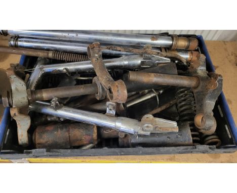 A box of vintage / classic motorcycle suspension parts, including fork stanchions, springs, yokes and a chrome swing arm