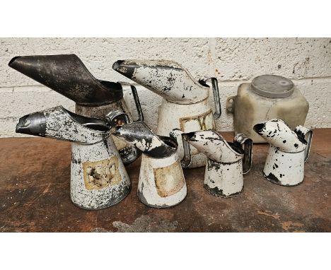 A set of six metric oil pourers and a windscreen washer bottle