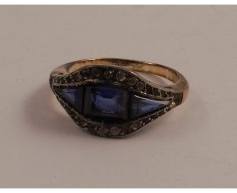 A blue and colourless paste set ring, unmarked