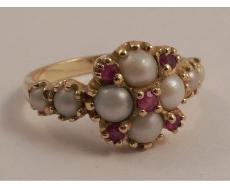 A 14 carat gold ruby and cultured pearl ring in the Victorian style, finger size P 1/2, 3.6g gross