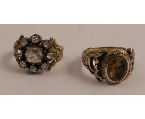 A Victorian diamond cluster ring, unmarked, the nine old mine cuts totalling approximately 1.2 carats, silver collet set, tog