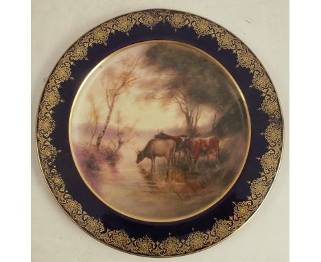 A Royal Worcester cabinet plate, decorated with cattle watering by John Stinton, to a blue and gilt border, dated 1903, af, d