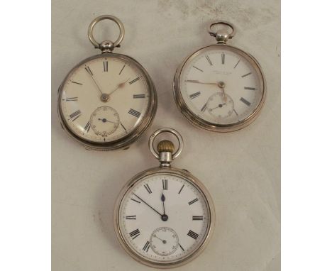 Three open face silver cased pocket watches, all with white enamel dials, makers Charles A Jones London, Gourlay &amp; Tate S