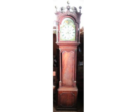 An Antique mahogany cased long case clock, the painted arched dial with sun and moon phased inscribed C Rutter Belbroughton, 