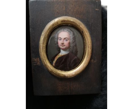 Christian Friedrich Zincke, unsigned, enamel on copper, portrait miniature of a wigged gentleman wearing a brown velvet jacke