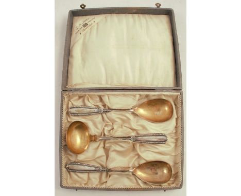 A cased set of silver cutlery, comprising a pair of spoons and a ladle, marked 800, weight&nbsp;