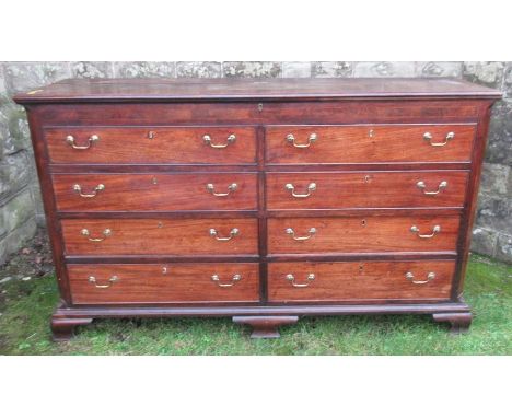 An 18th century Lancashire mule chest, fitted with a plain rising lid, with four short dummy drawers below, over four further