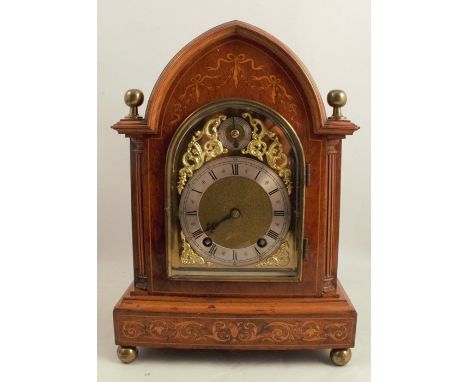 An Edwardian mahogany and satinwood mantel clock, with eight day movement, gilt dial with silver chapter ring and Roman numer