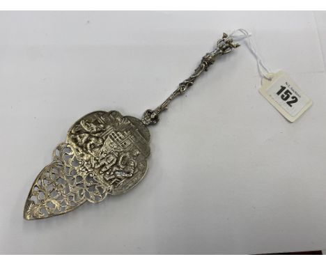 An ornate carved silver spoon, 60 grams