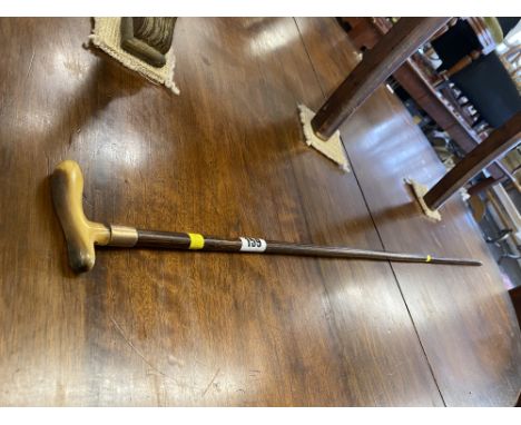 A gentleman's walking stick with 9ct gold strap/ bone handle