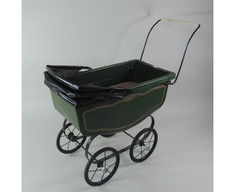 A vintage Triang painted metal doll's pram, 66cm long