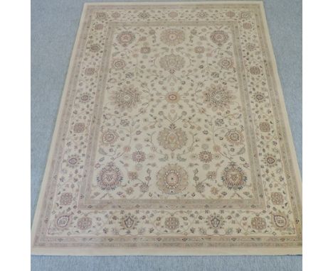 A modern woollen carpet on a cream ground, 230 x 170cm