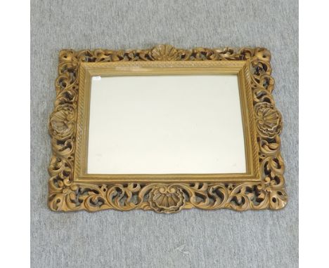 A gilt framed wall mirror with a pierced surround, 62 x 52cm