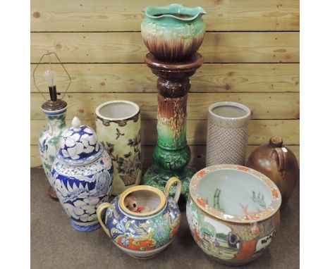 A collection of vases, to include a majolica jardiniere on stand, 93cm tall and a Chinese planter