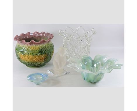 A coloured glass centrepiece, 28cm tall, together with two coloured glass bowls, a model of a cat and a majolica planter