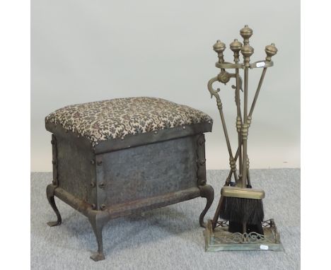 An Arts and Crafts coal purdonium, together with a set of brass fire tools 