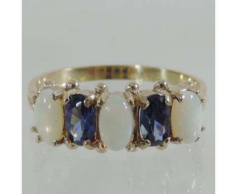 A 9 carat gold, sapphire and opal ring, boxed 