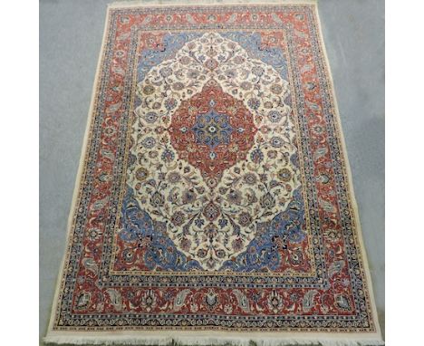 A Keshan carpet, with floral design on a blue ground, 370 x 250cm