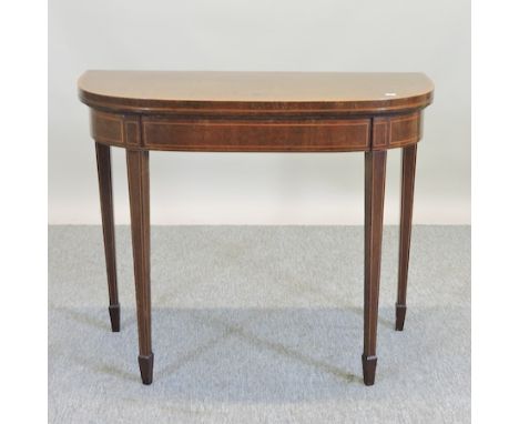 A George III mahogany D shaped folding card table, 91cm