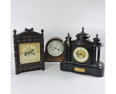 An Edwardian slate mantle clock, with a presentation plaque dated 1912, 35cm tall, together with two other clocks