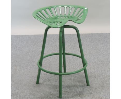 A green painted tractor seat bar stool 