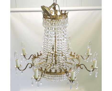 A gilt metal and cut glass eight branch chandelier, 68cm diameter 