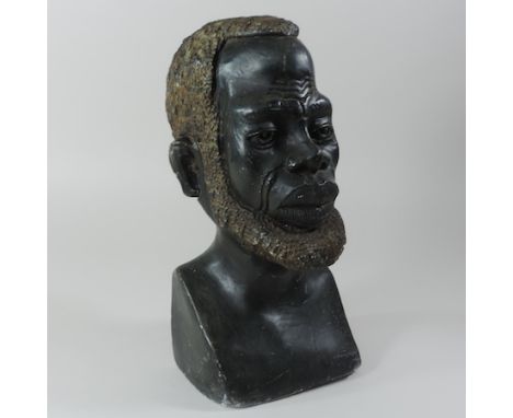 An African carved hardwood portrait bust of a man, 42cm tall