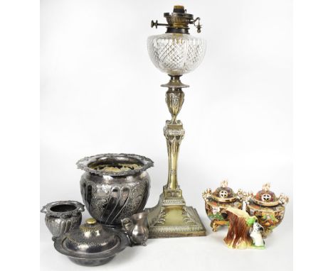 A Victorian plated oil lamp, the base in the form of a Neo-Classical column with urn, on a square base with acanthus leaves, 