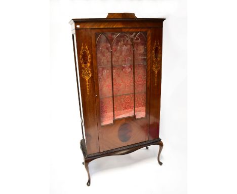 A 20th century mahogany inlaid display cabinet, the back and lower shelf covered in pink damask fabric, two interior shelves,