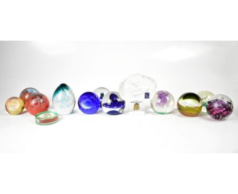 A collection of fourteen predominantly Caithness glass paperweights with further examples from Langham Glass, Dartington Crys