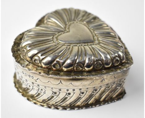 A Victorian hallmarked silver heart-shaped trinket box, with embossed triple-heart decorated lid, heart-shaped body decorated