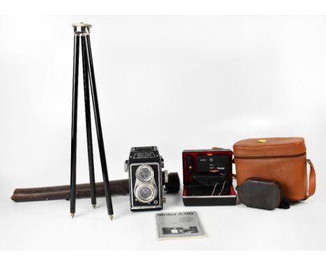 A vintage Lipca Rollop camera in brown leather carry case, a travel tripod in brown leather case, various accessories includi