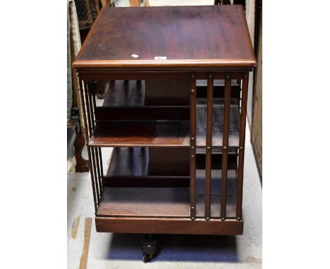 A mid-20th century mahogany revolving bookcase, 92 x 59 x 59cm. CONDITION REPORT Overall solid but used condition, the top su