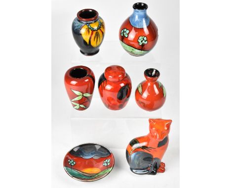 POOLE; a group of seven ceramics to include a baluster bud vase, height 14cm, a small plaque in the 'Sunrise' design, diamete