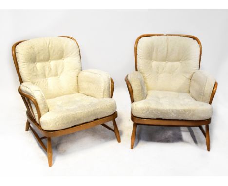 ERCOL; a set of four Jubilee stick back lounge chairs with turned cross stretchered supports (4).