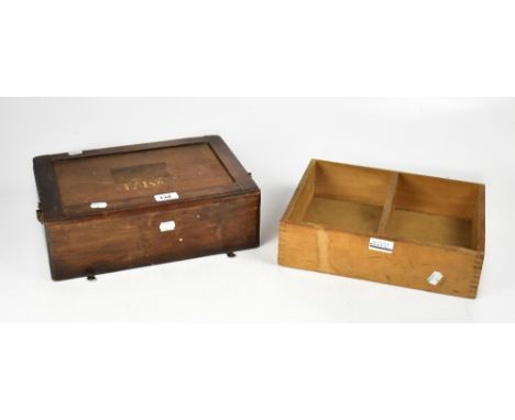 An early 20th century wooden wall-hanging First Aid box, containing a quantity of First Aid items, lint dressing, stretch fab