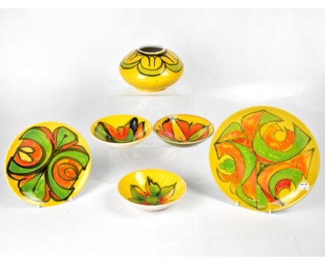 POOLE; a group of six ceramics in the 'Delphis' yellow ground pattern, to include a circular plate, diameter 25cm, a smaller 