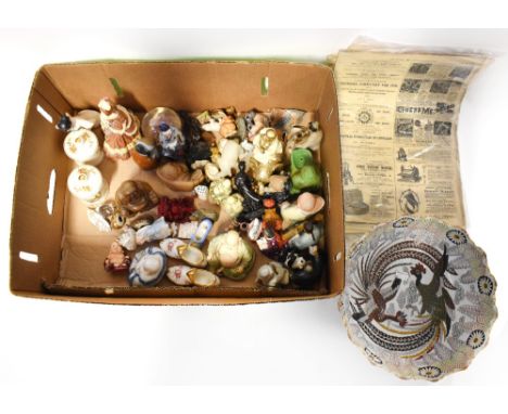 A collectors' lot comprising miniature bisque figures of mainly children, cherubs, birds and shoes, displayed under a Victori