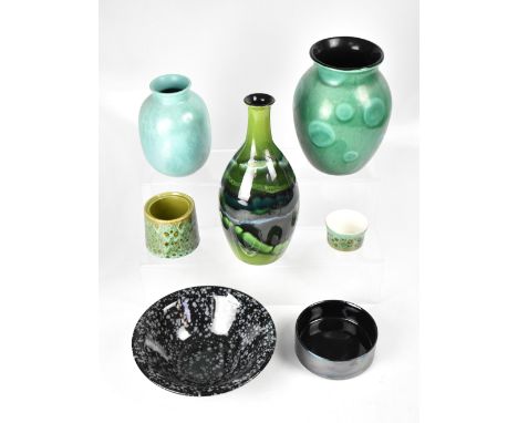 POOLE; a group of seven ceramics to include three varying size baluster vases, all with green ground and various decoration, 