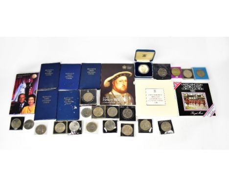 A mixed lot of coins comprising a King Henry VIII Anniversary crown, in slip case, a Golden Wedding commemorative crown dated