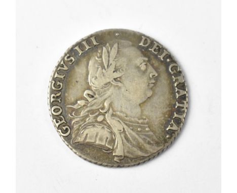 A George III 1787 silver shilling. CONDITION REPORT Good clear definition to the text, slight flats to the head but good faci