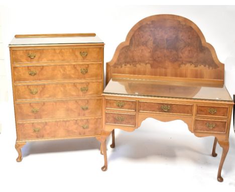 A reproduction burr walnut harlequin three-piece bedroom suite comprising a five-drawer chest raised on shell carved squat ca