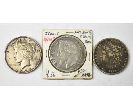 A USA 1880 Morgan silver dollar, a 1922 silver Peace dollar and a French 1870 Napoleon III silver five franc coin (3).